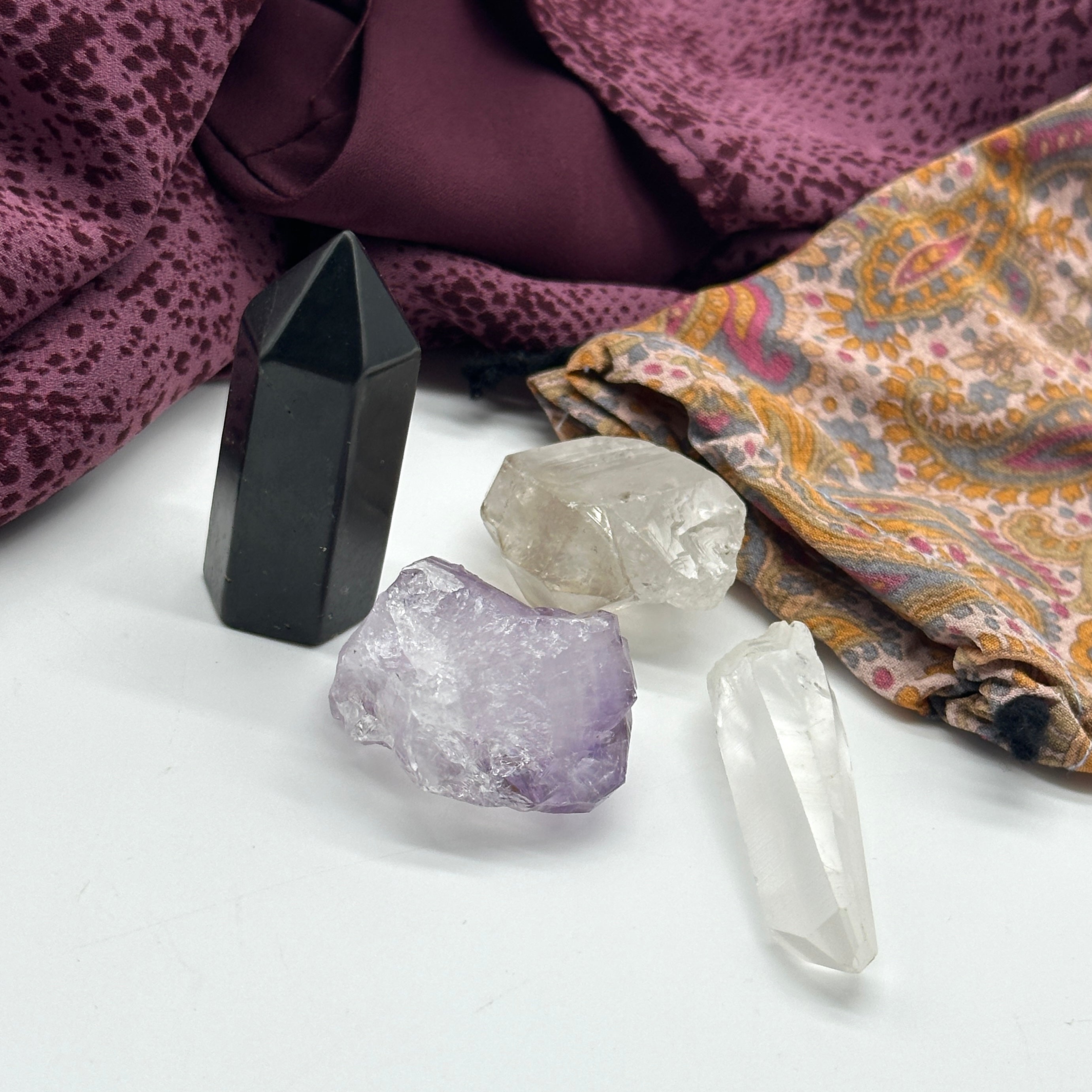 Crystal Set of Four Includes: Tibetan Smoky Quartz DT Point, Amethyst Rutile Natural Point, Mini Lemurian Seed Quartz Crysal, Mini Shungite Tower