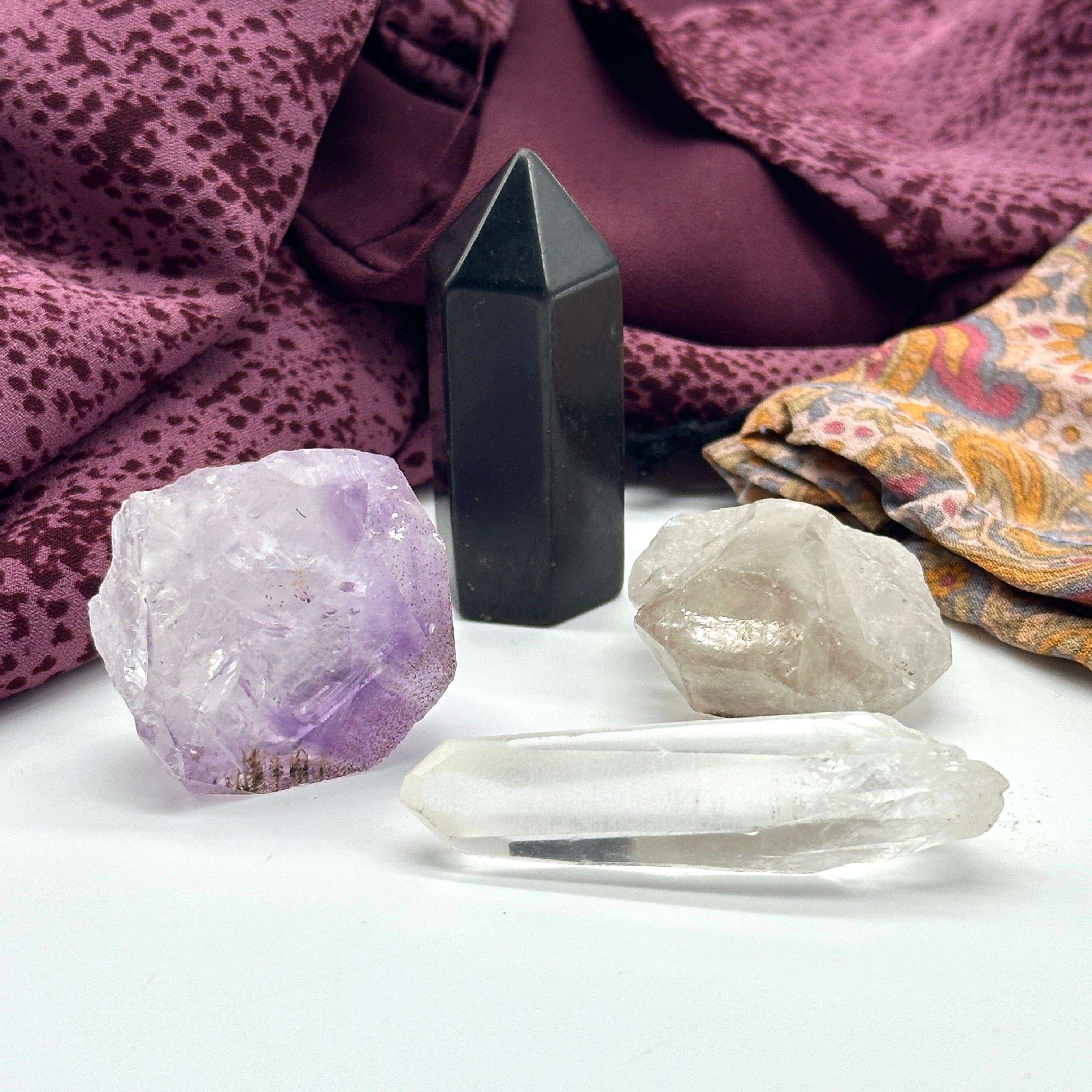 Crystal Set of Four Includes: Tibetan Smoky Quartz DT Point, Amethyst Rutile Natural Point, Mini Lemurian Seed Quartz Crysal, Mini Shungite Tower