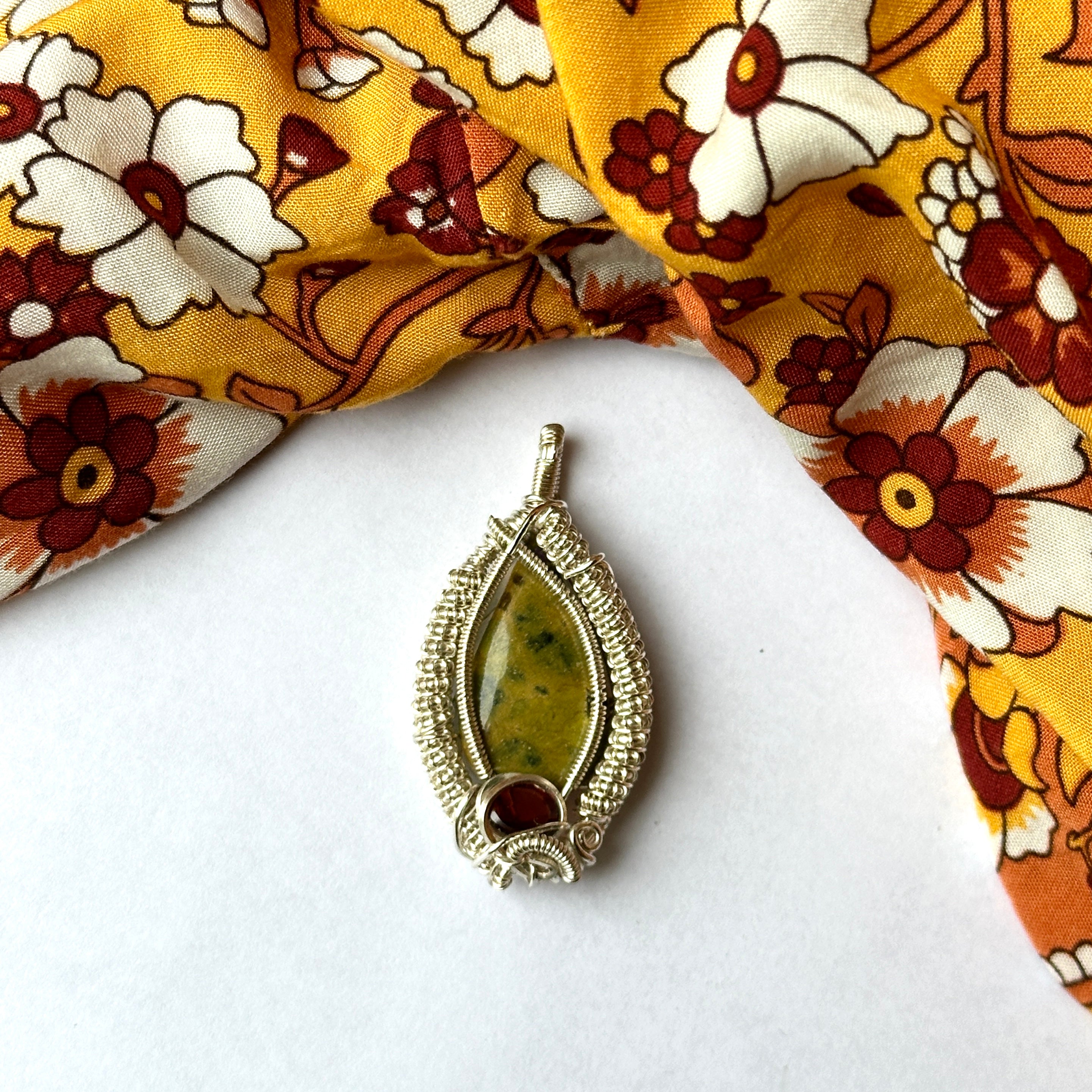 Incredible Unique Atlantisite Stone with Garnet in a Silver Wire Wrapped Setting