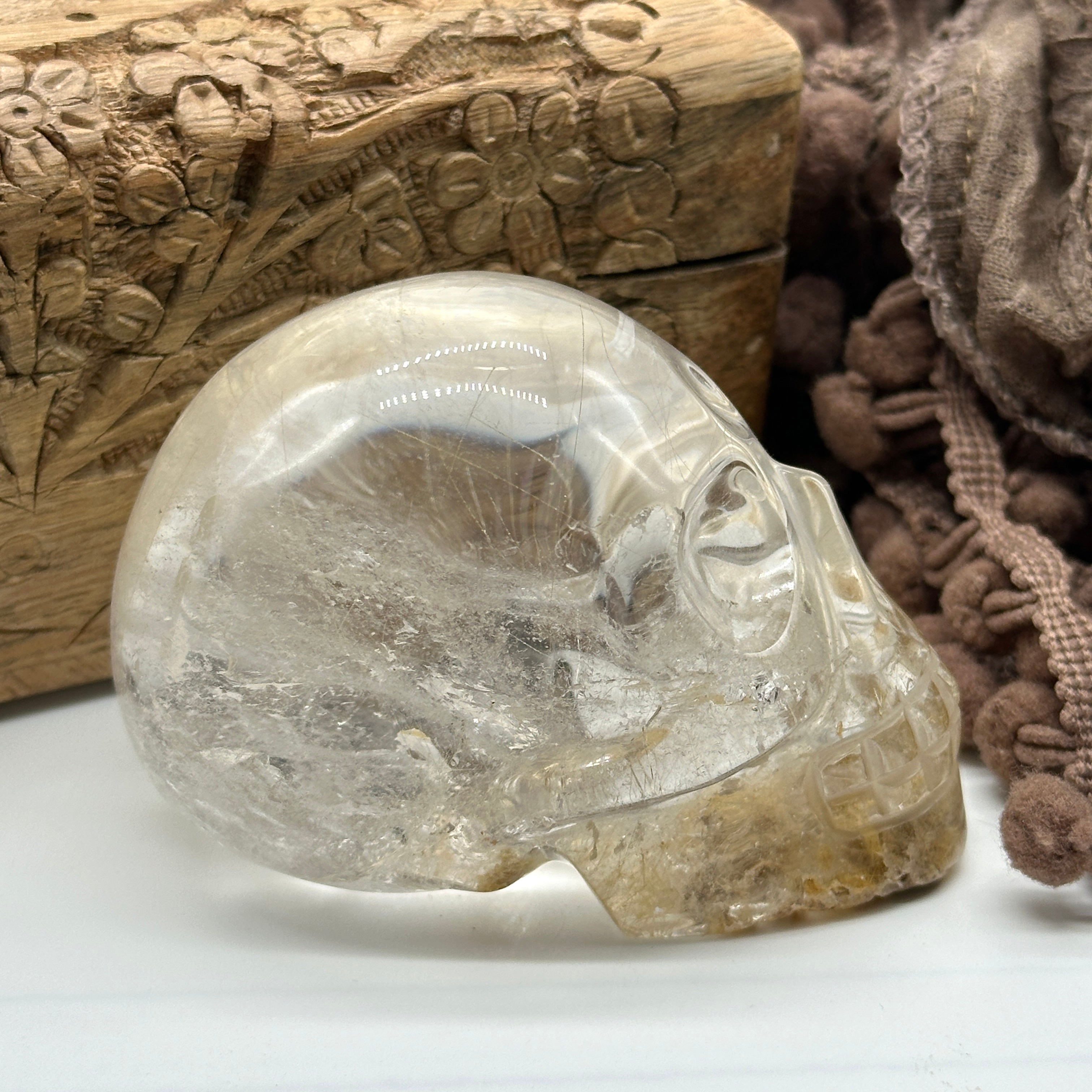 Clear Quartz Crystal Skull Carving with Golden Rutile Inclusions from Brazil