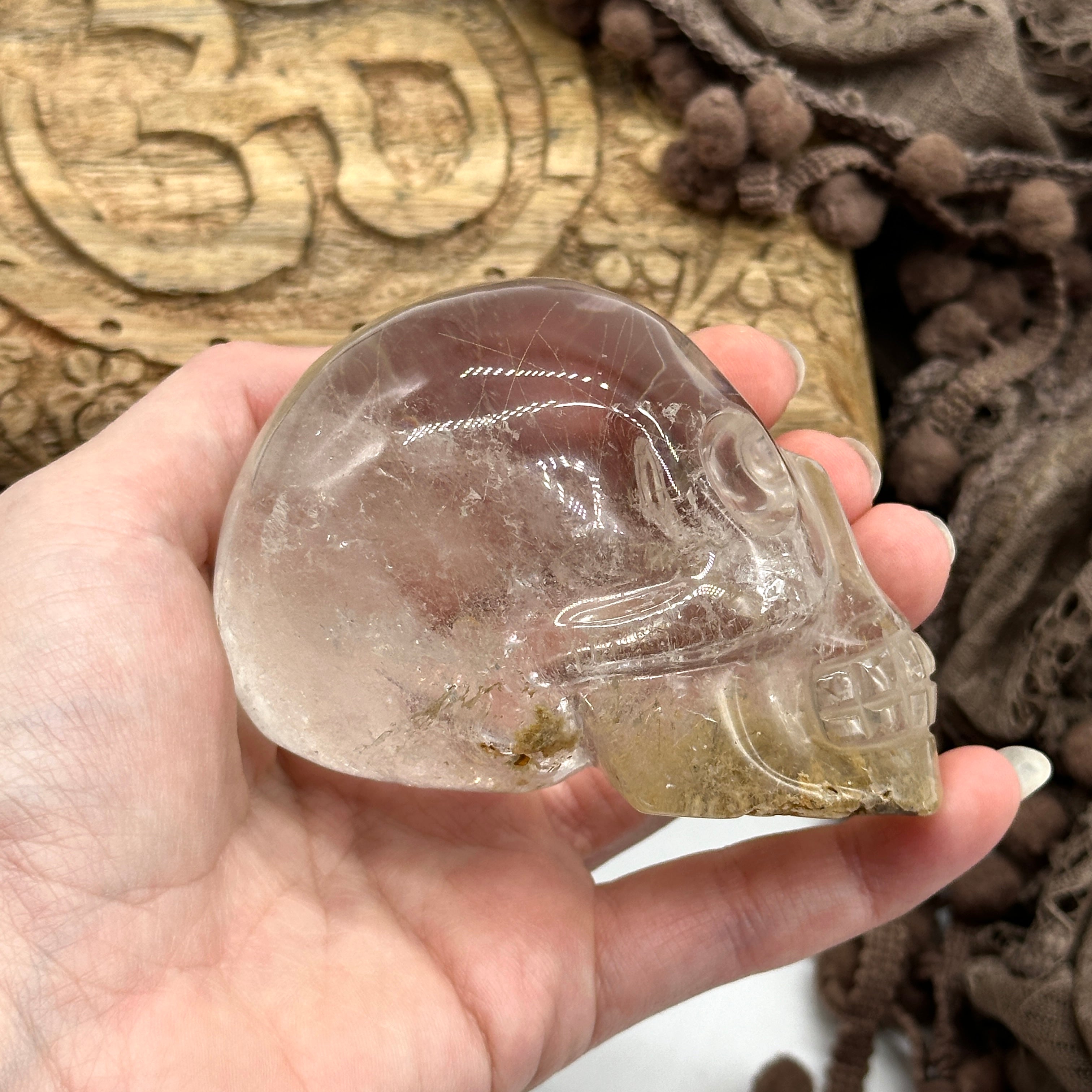 Clear Quartz Crystal Skull Carving with Golden Rutile Inclusions from Brazil