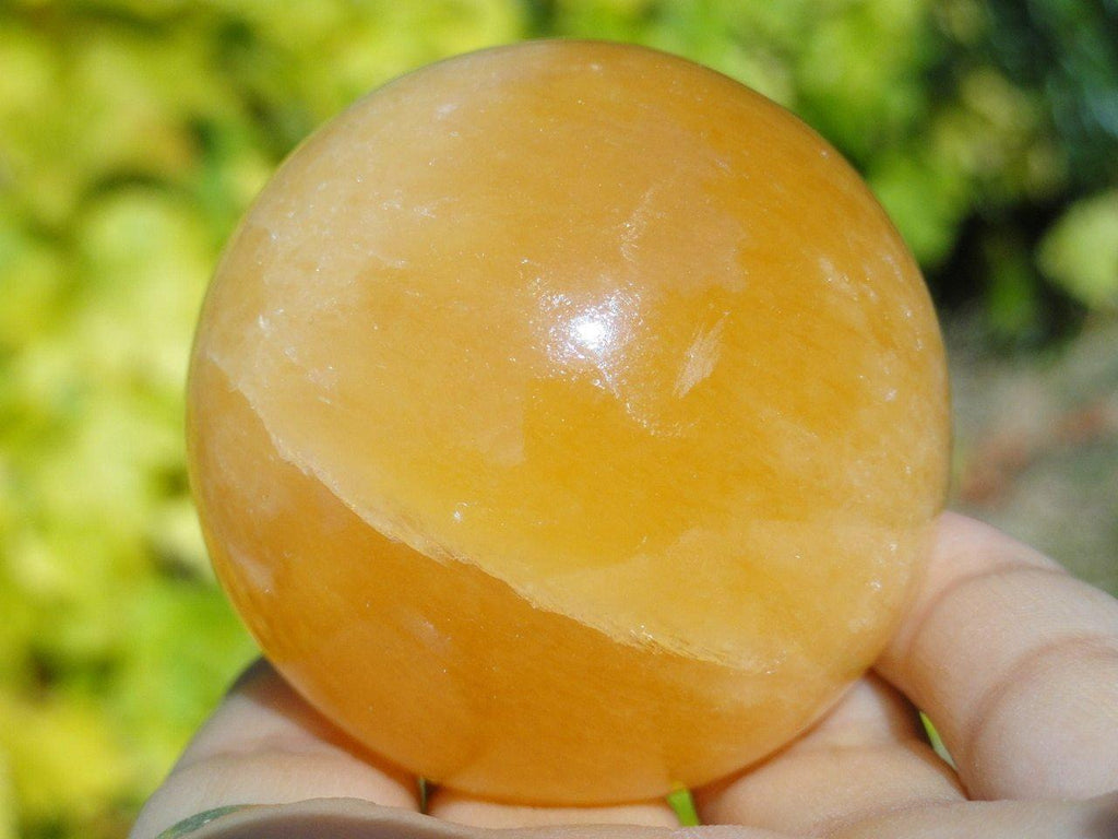 ORANGE CALCITE SPHERE - Earth Family Crystals