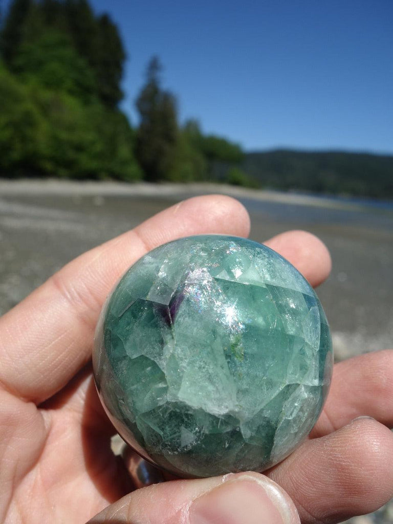 Pretty Green Fluorite Sphere Carving With Hints of Purple - Earth Family Crystals