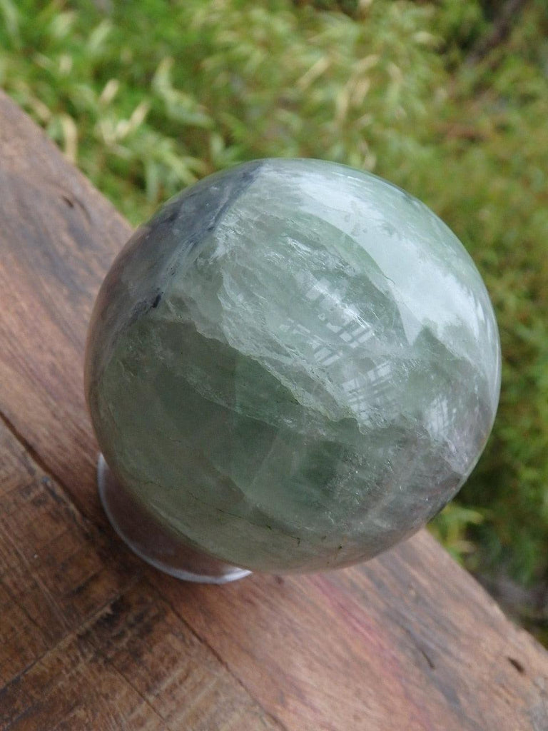 Green Fluorite Sphere With Hidden Rainbow Inclusions - Earth Family Crystals