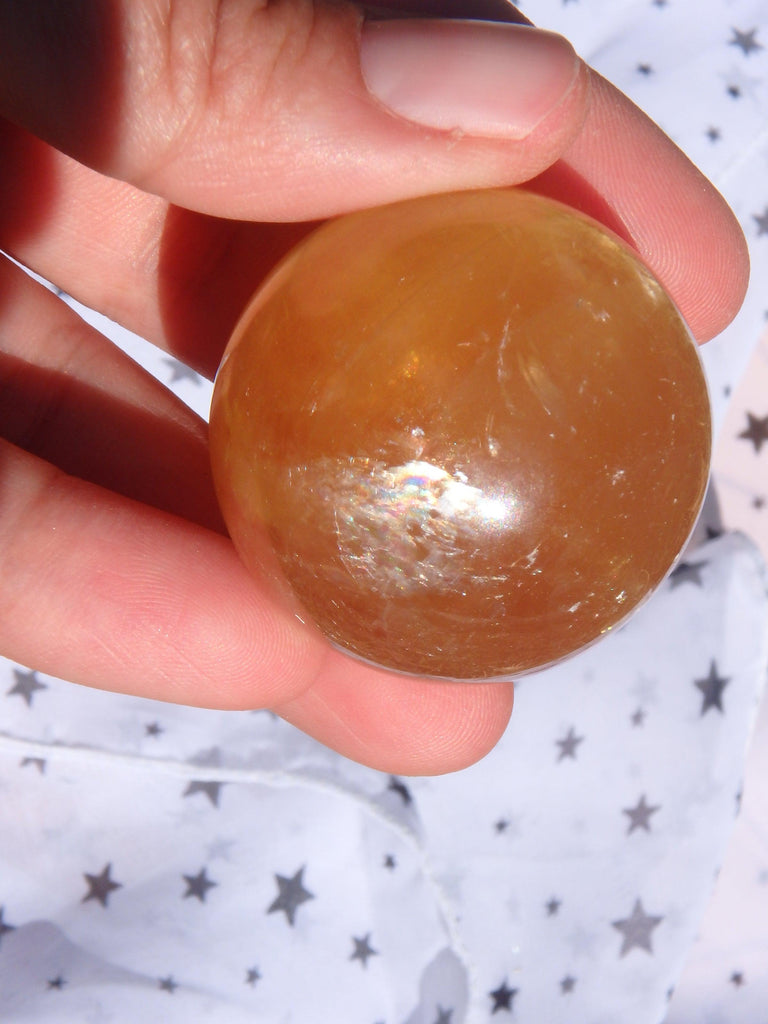 Uplifting Optical Golden Honey Calcite Sphere Carving With Rainbows 1 - Earth Family Crystals