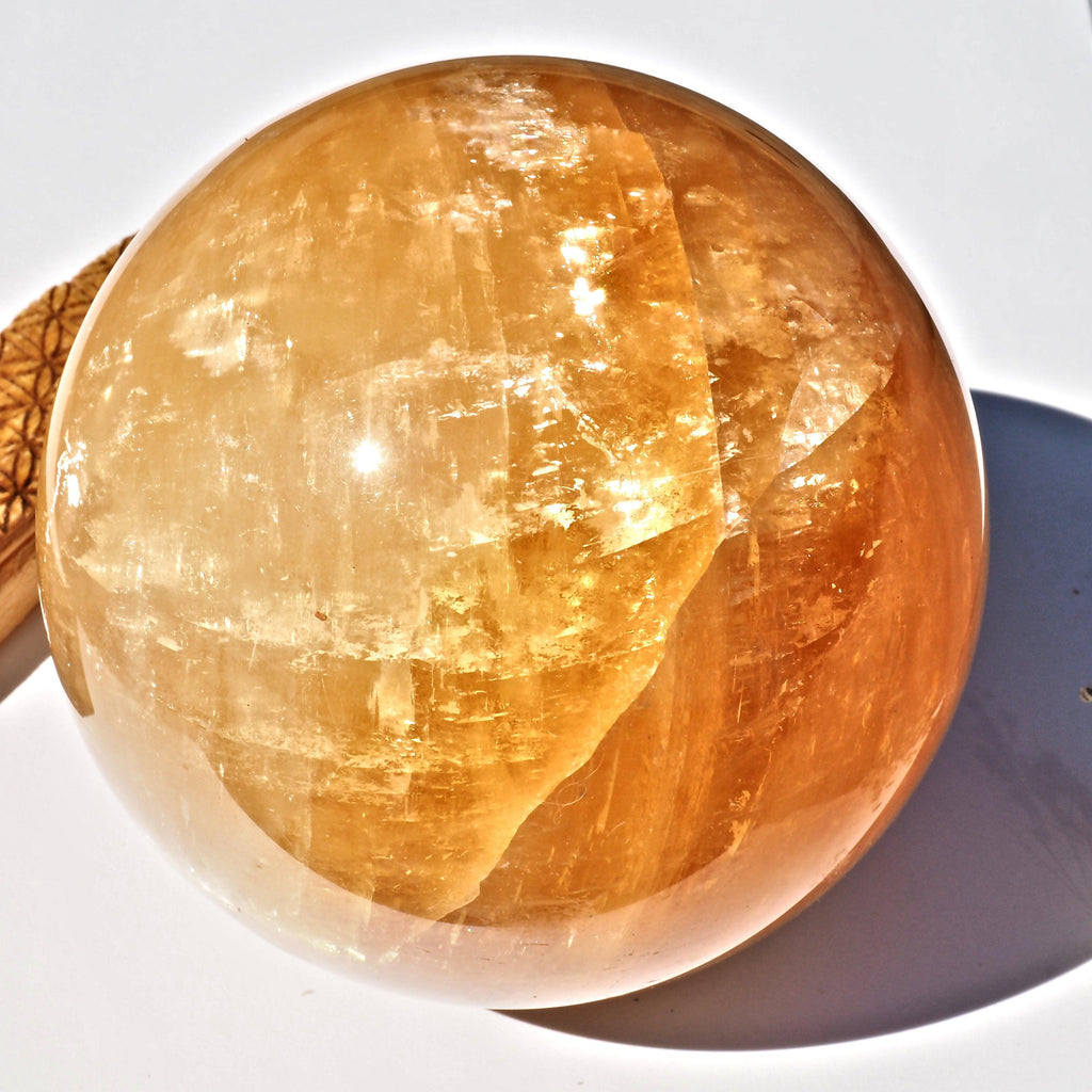 Jumbo Supreme Massive Golden Honey Calcite Sphere carving - Earth Family Crystals