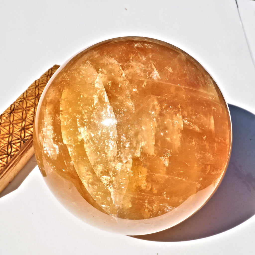 Jumbo Supreme Massive Golden Honey Calcite Sphere carving - Earth Family Crystals