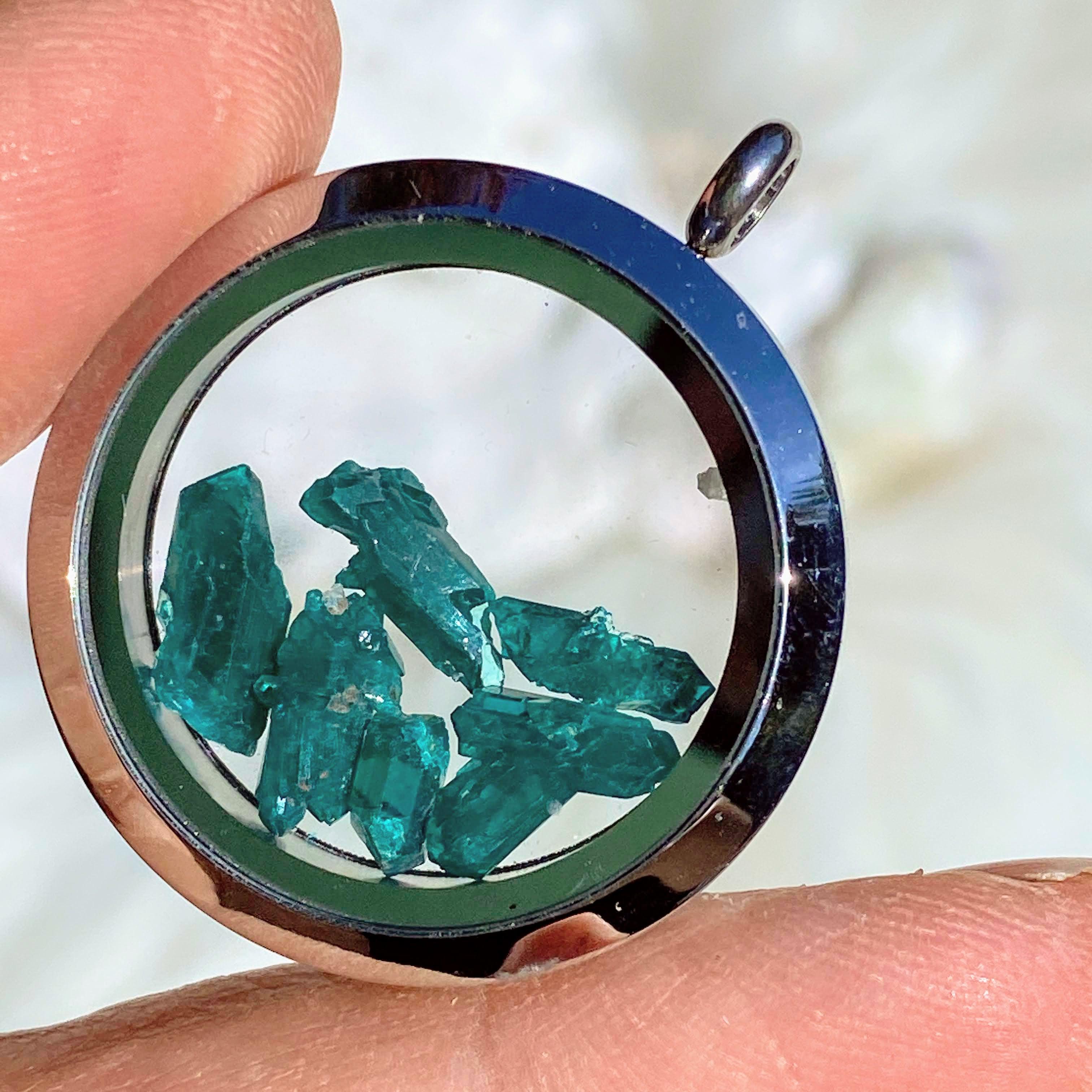 One Dioptase Floating Crystals in Stainless steel/Glass Locket pendant (Includes Silver Chain) - Earth Family Crystals