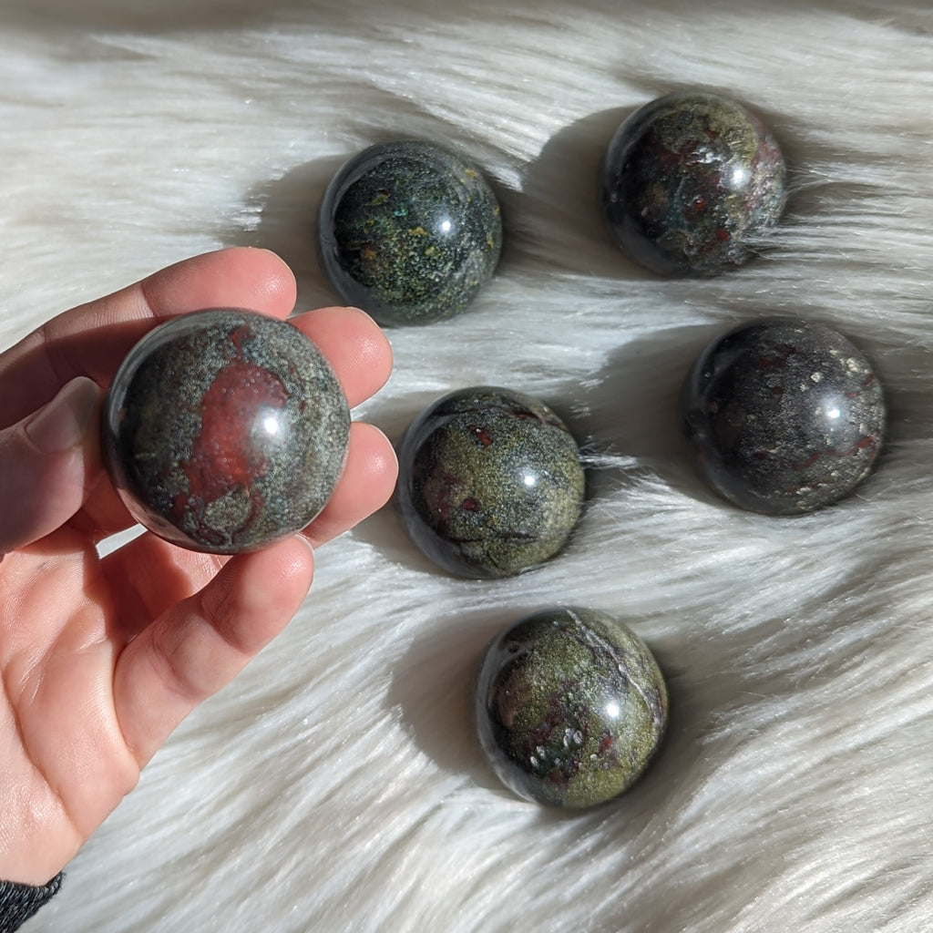 One Dragons Blood Jasper Sphere Carving - Earth Family Crystals