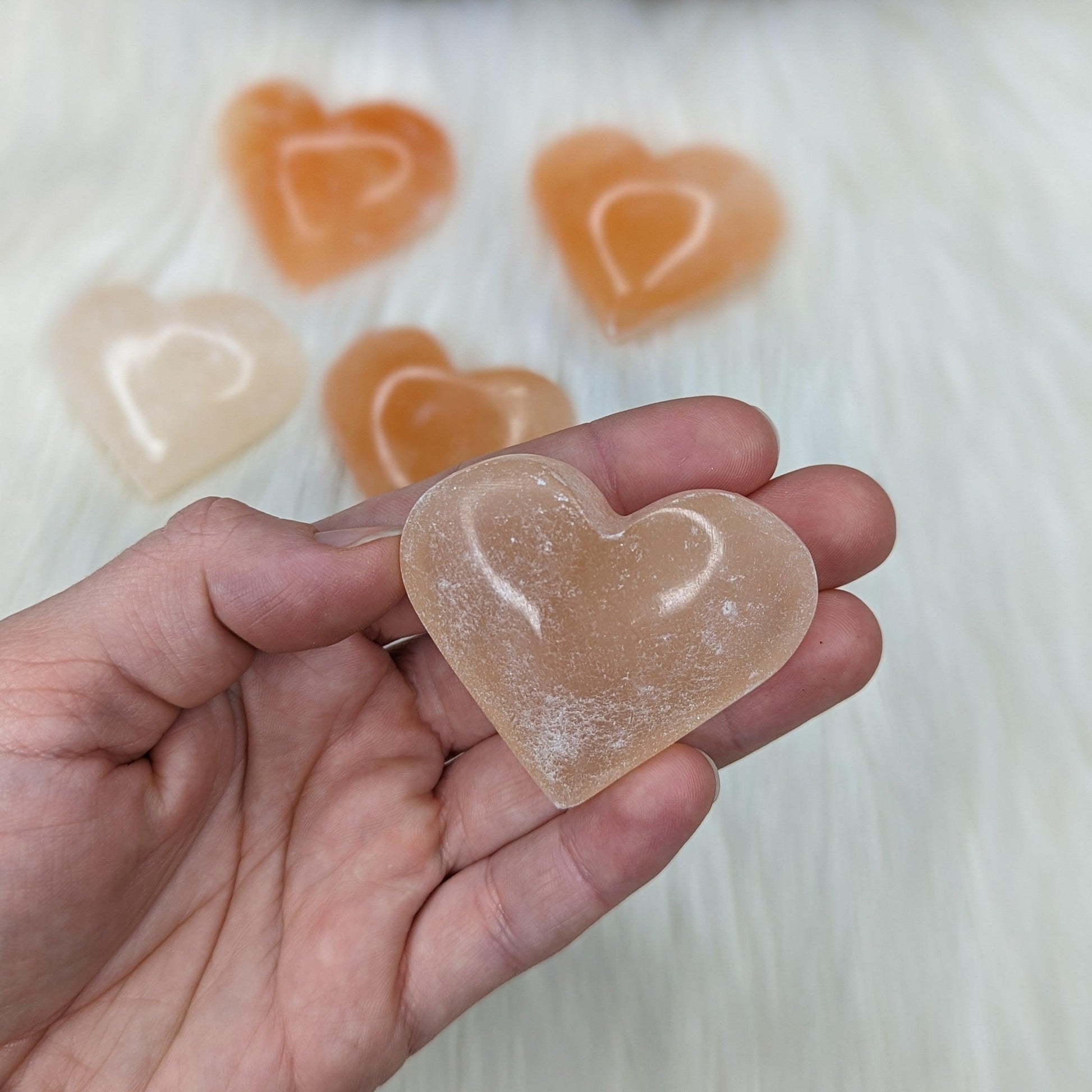 Orange Selenite Palm Stone Heart Carving - Earth Family Crystals