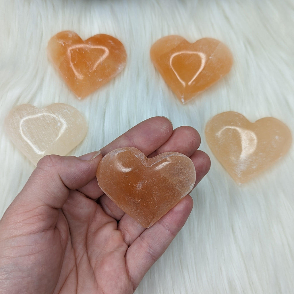 Orange Selenite Palm Stone Heart Carving - Earth Family Crystals
