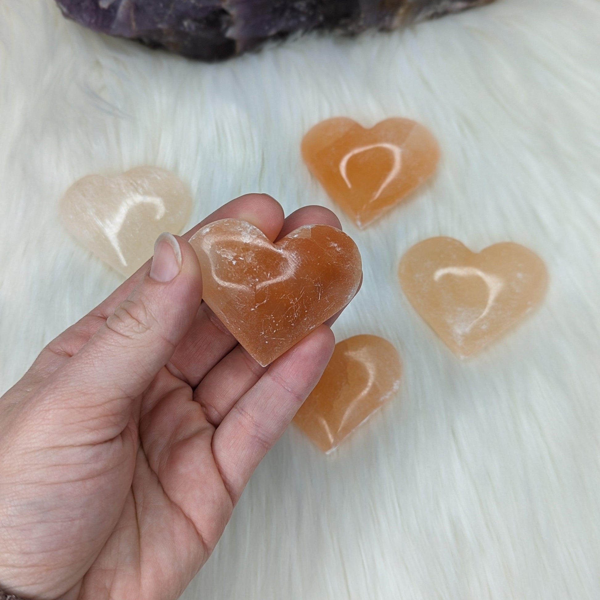 Orange Selenite Palm Stone Heart Carving - Earth Family Crystals