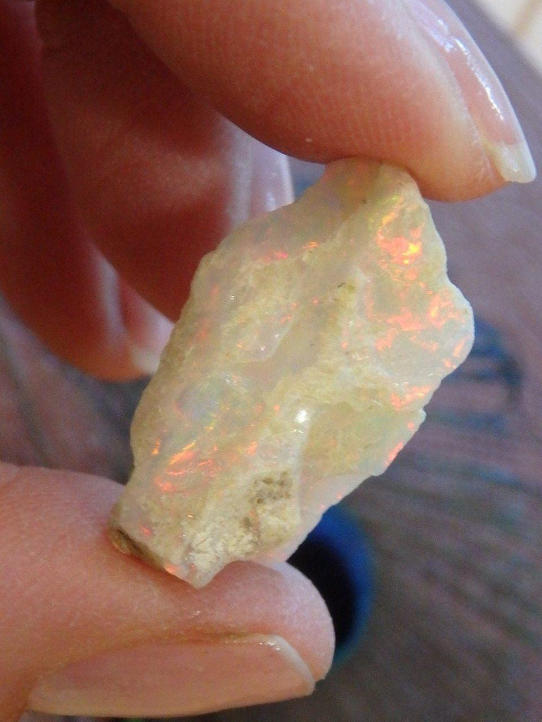 Creamy White Ethiopian Opal With Fire Red Flash Specimen - Earth Family Crystals