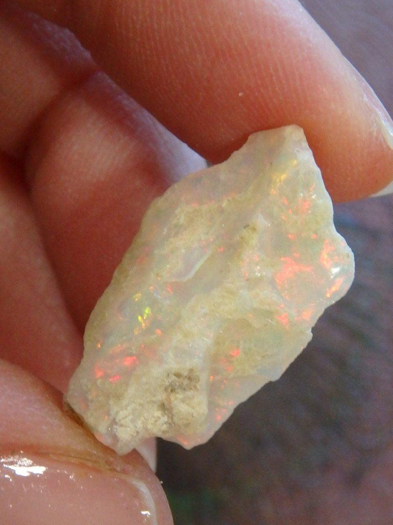 Creamy White Ethiopian Opal With Fire Red Flash Specimen - Earth Family Crystals