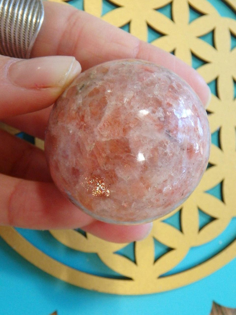 Pretty Flashes Sunstone Sphere Carving 1 - Earth Family Crystals